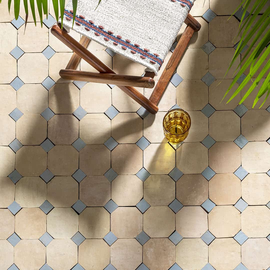 Light beige with soft blue diamond tile accents, creating a geometric design.