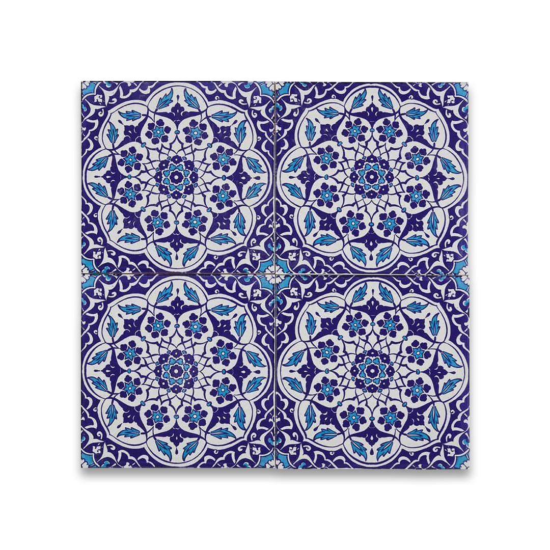 Decorative tile with blue and white pattern on a white background