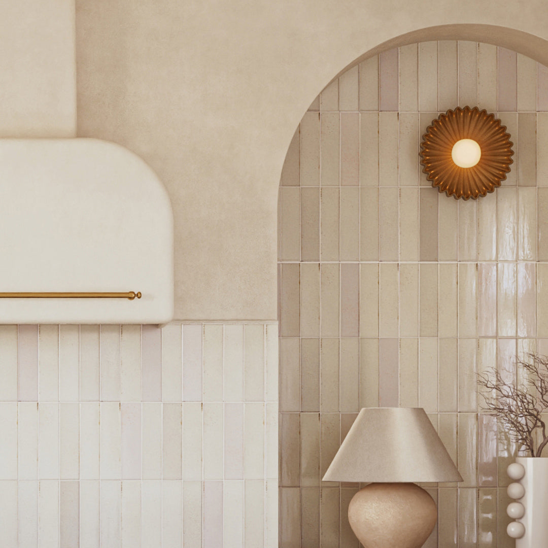 Decorative interior with tiled wall, lamp, and archway.