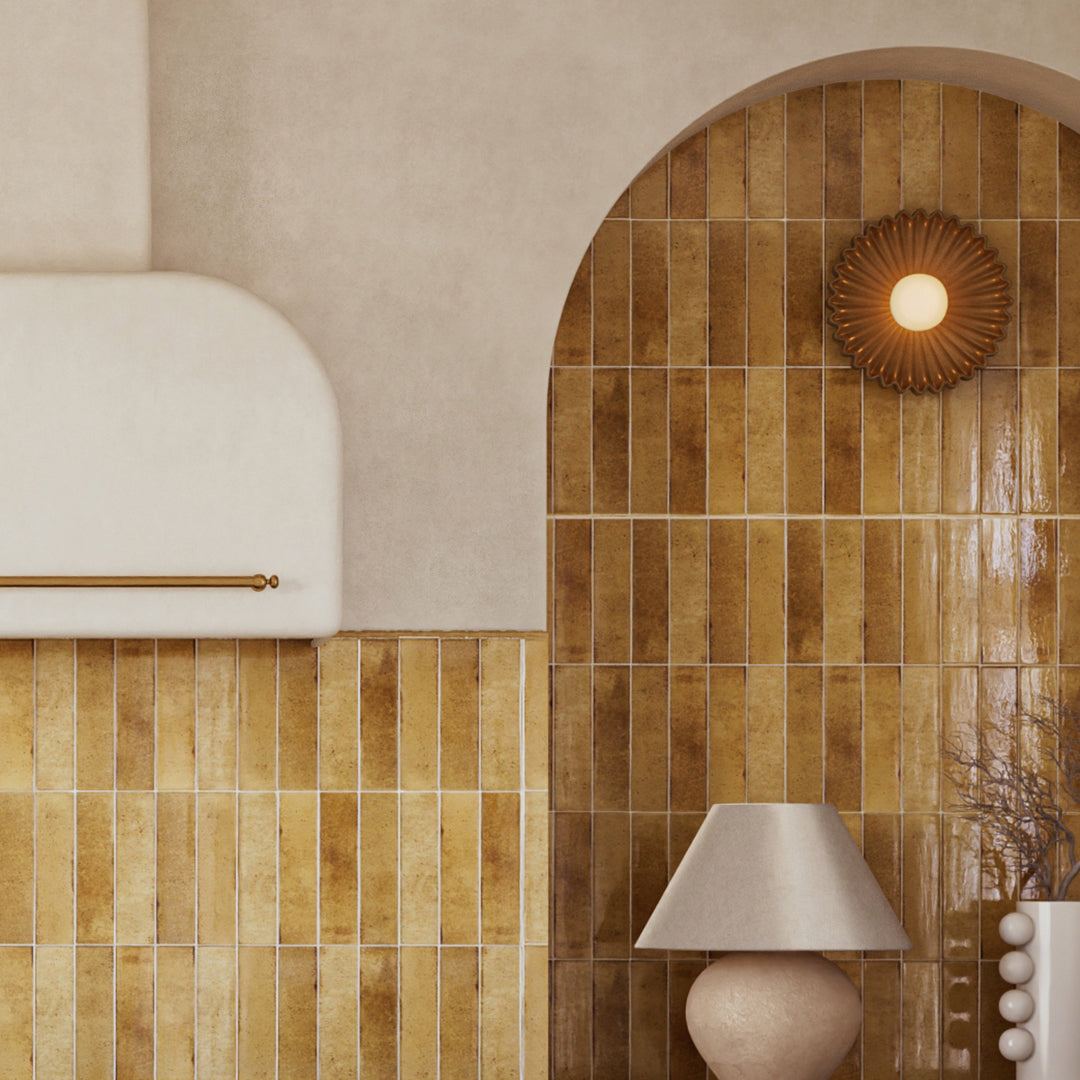 Decorative wall with brown tiles and a lamp, featuring a warm and inviting atmosphere.