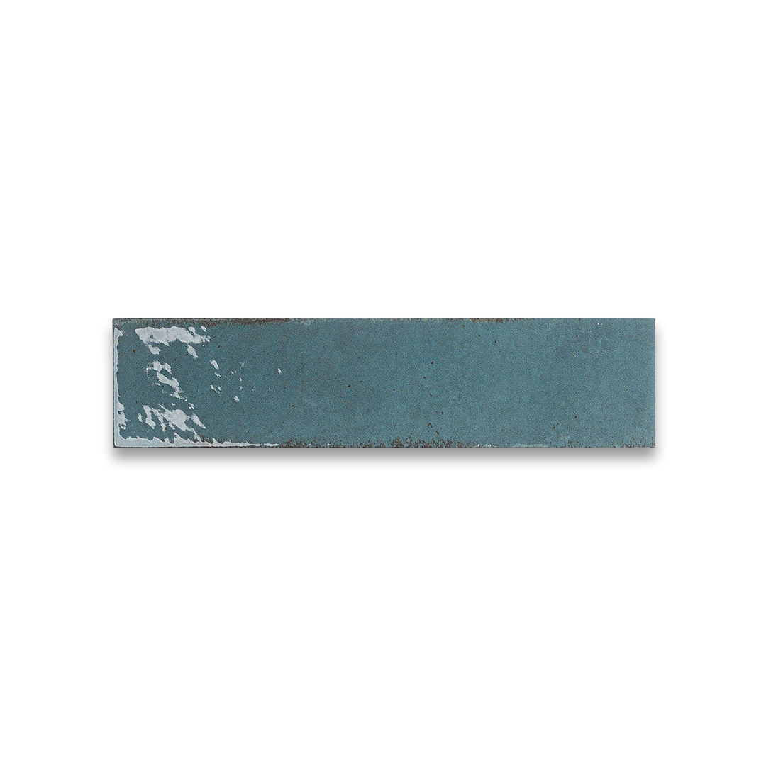 Rectangular blue tile with a white speck on a white background