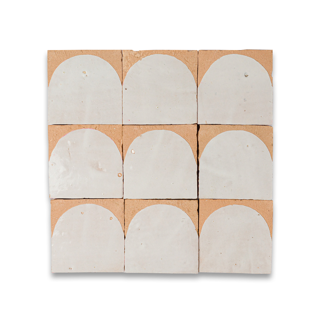 Set of nine white oval tiles on a cardboard backing