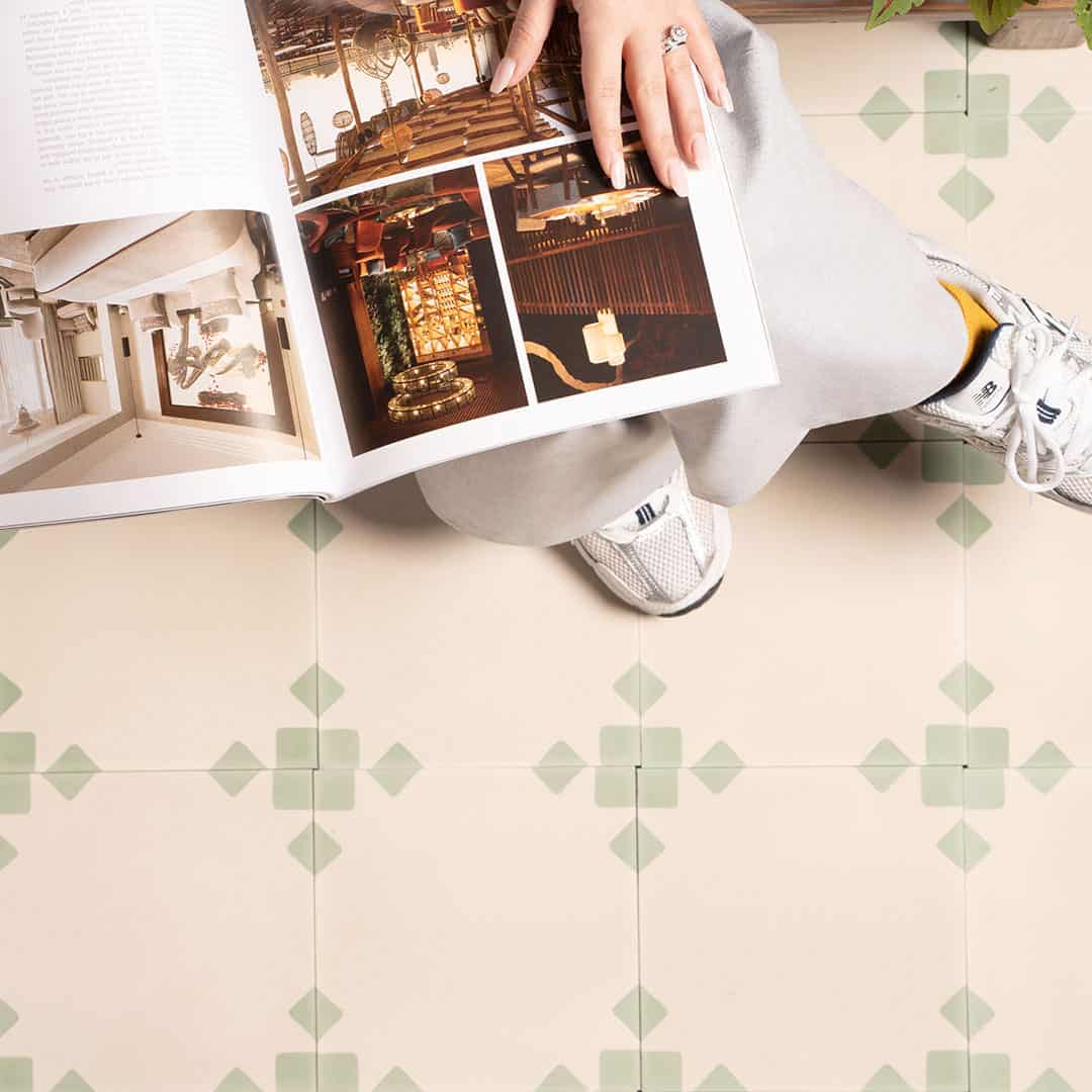 Sage Edge cement tile featuring a soft cream base with muted sage green corner accents, ideal for modern interiors, patterned flooring, and wall applications in contemporary spaces.