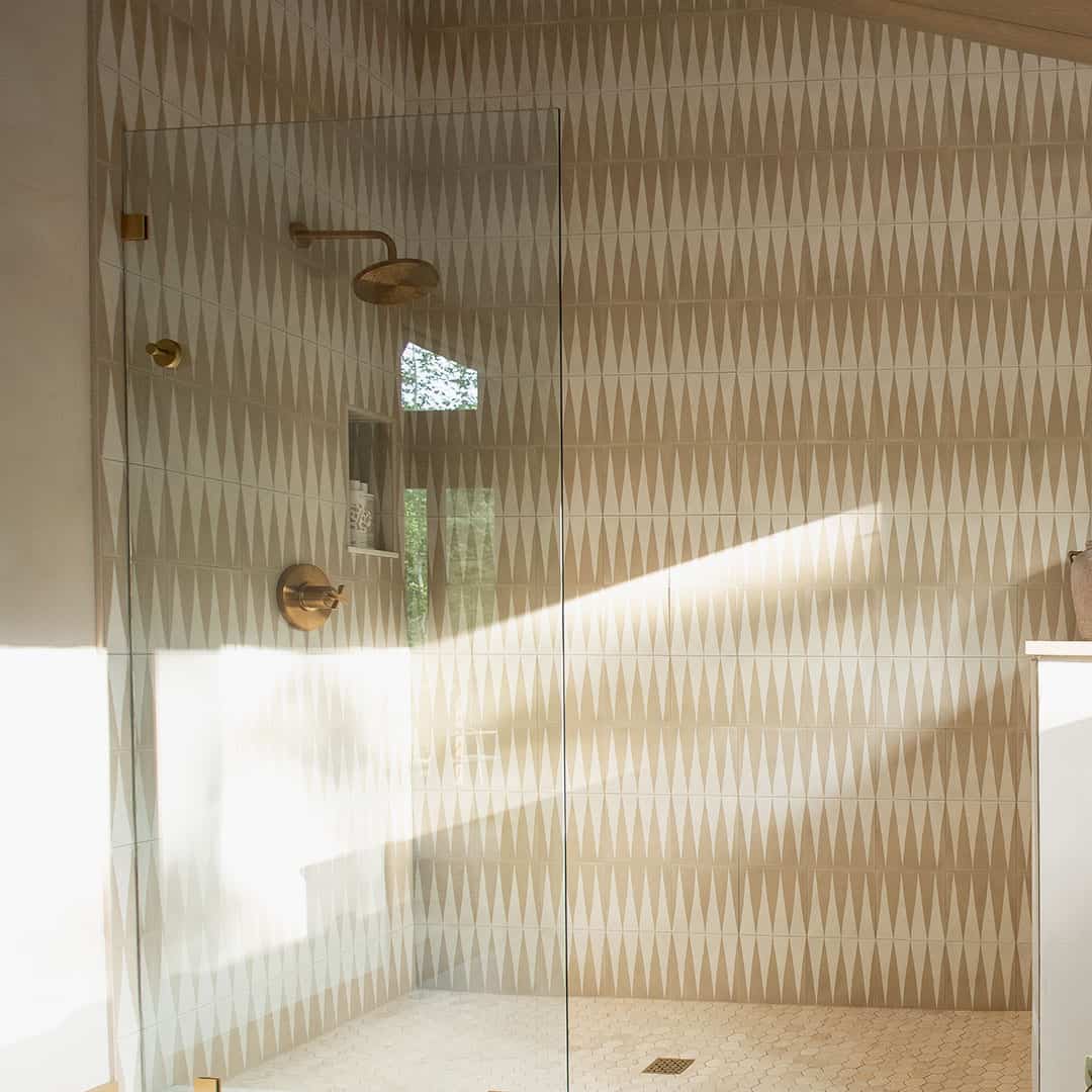 An alternating beige and white elongated triangular patterns forming a geometric zigzag motif, ideal for modern flooring, wall accents, or Scandinavian-inspired interior decor.