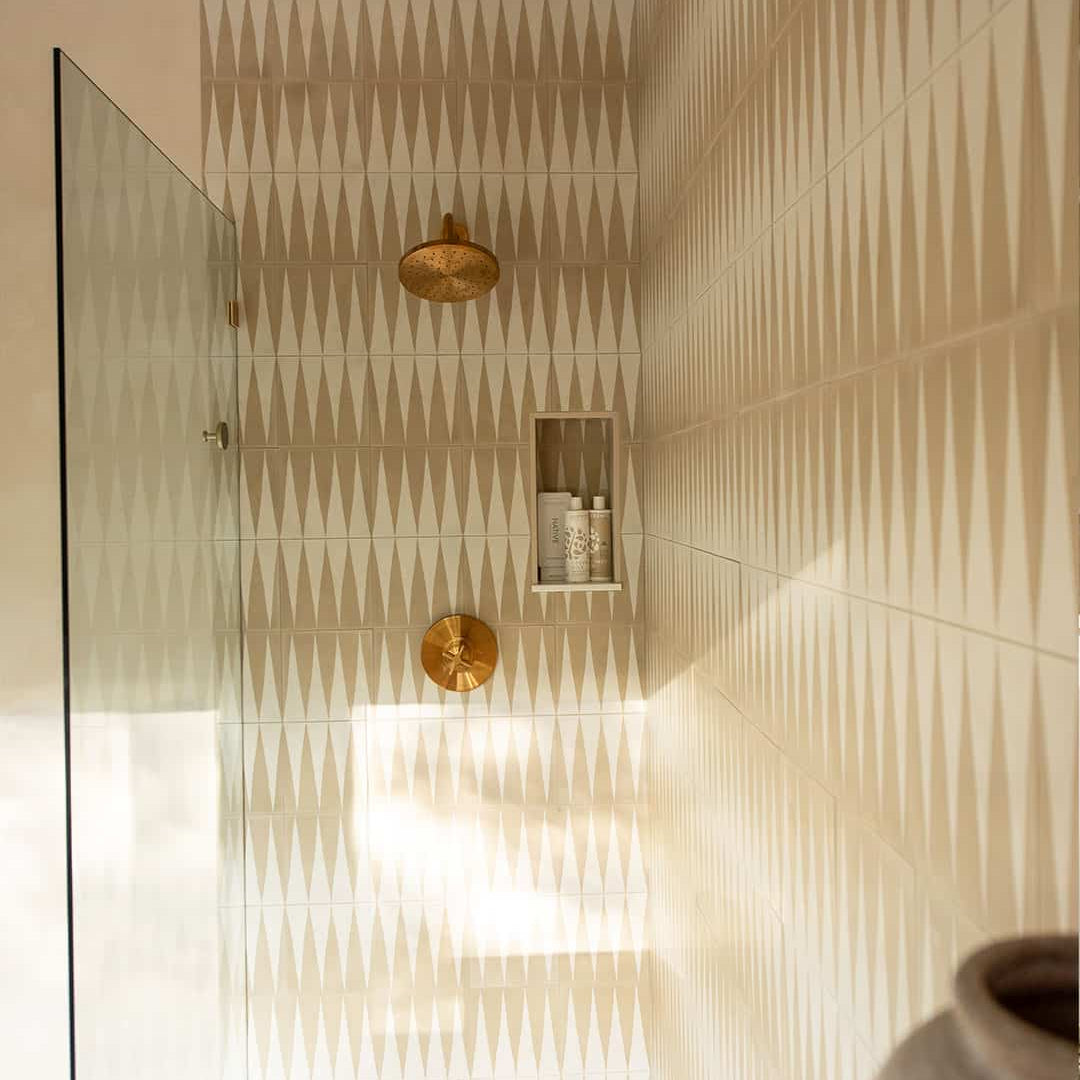 An alternating beige and white elongated triangular patterns forming a geometric zigzag motif, ideal for modern flooring, wall accents, or Scandinavian-inspired interior decor.