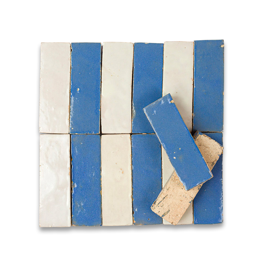 Decorative wall art made of blue and white tiles on a white background