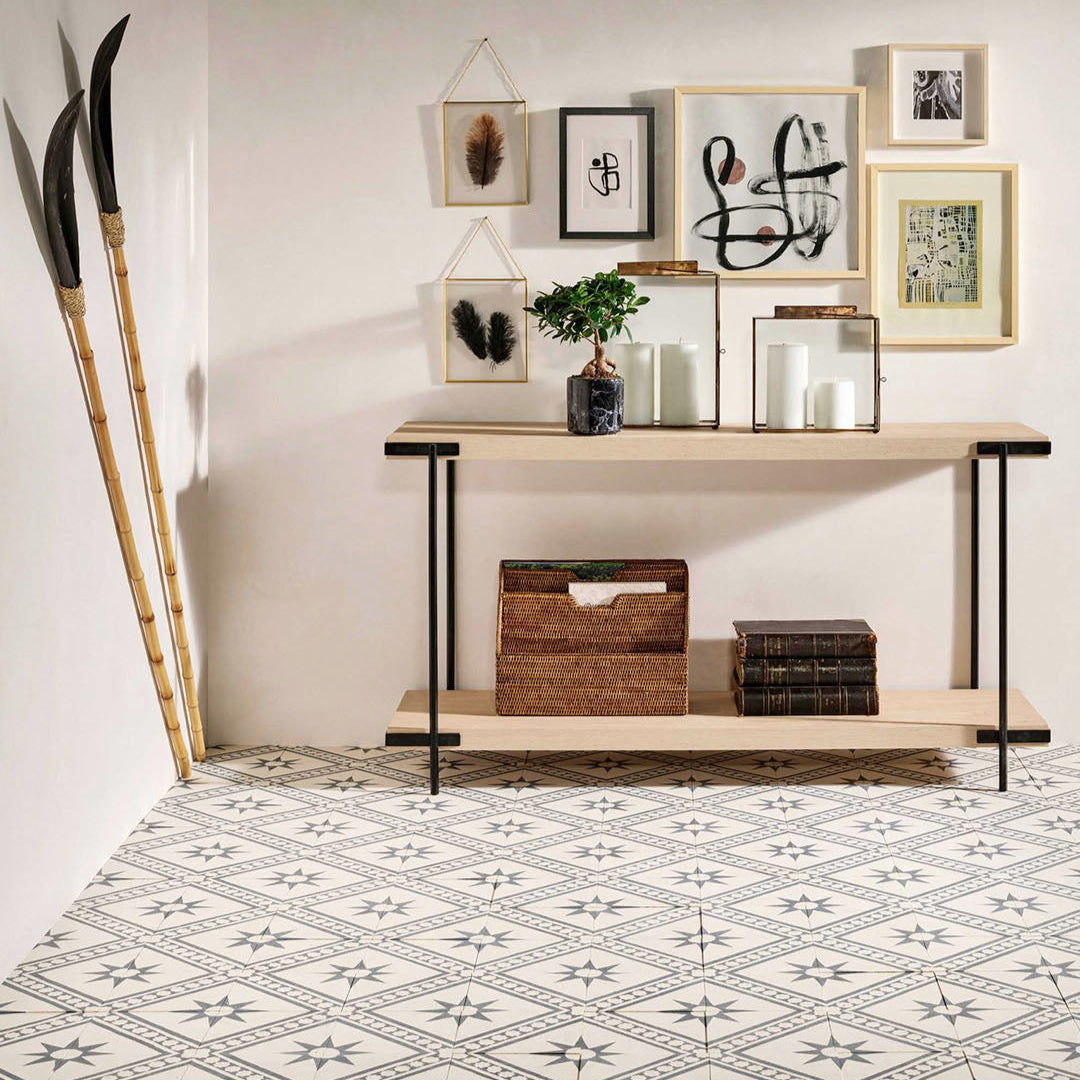 Starline Diagonal cement tile featuring a cream base with dark grey geometric star motifs and diagonal stripe accents, ideal for Mediterranean interiors, patterned flooring, and decorative wall applications.