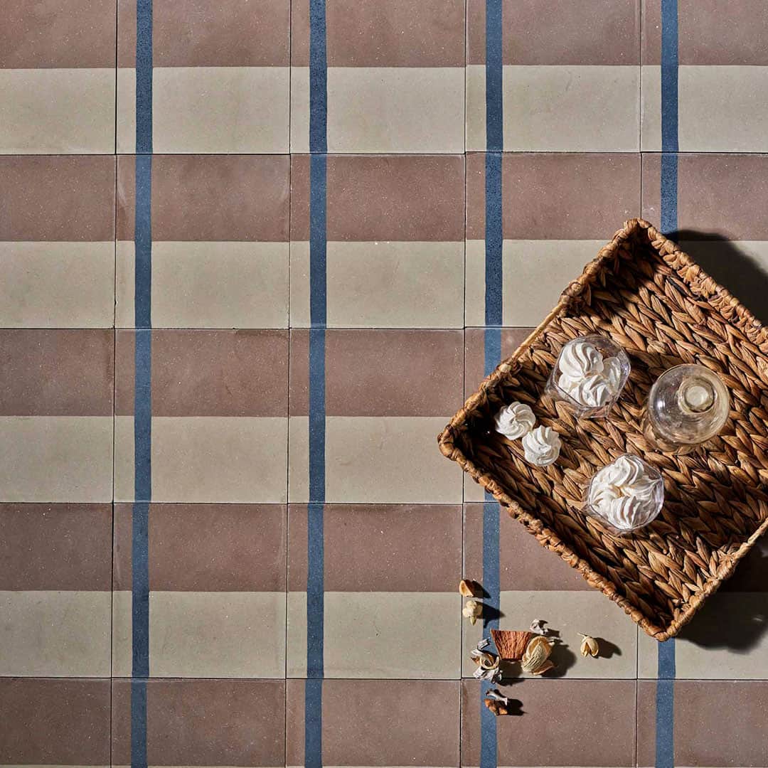 A geometric pattern with terracotta brown, beige, and a vertical blue stripe, ideal for modern flooring, wall accents, or minimalist interior decor.