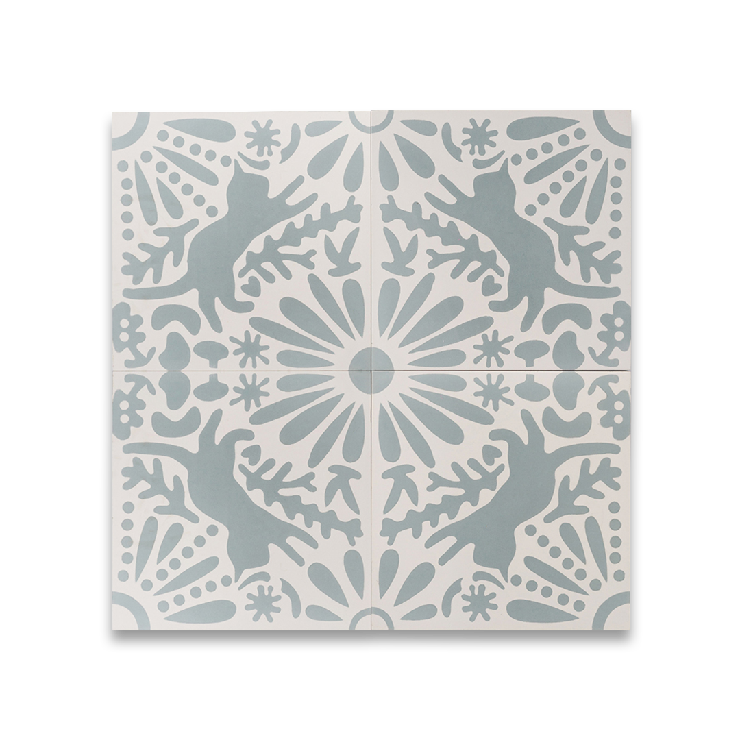 Decorative tile with blue and white pattern on a white background