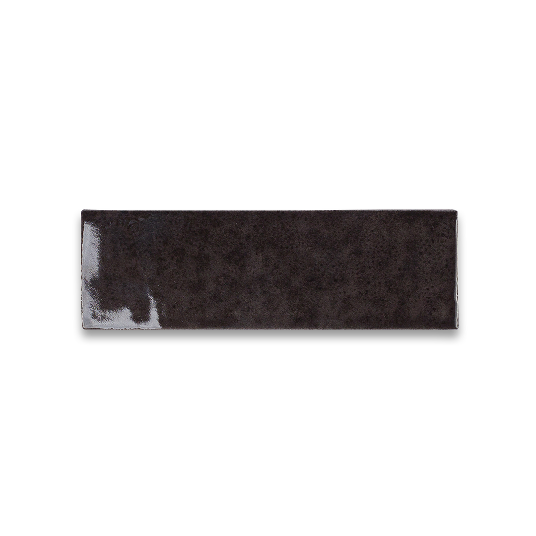 Rectangular black and gray cowhide rug on a white background