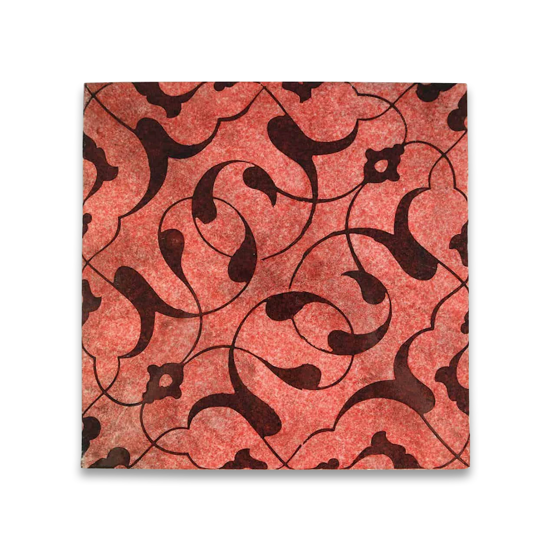 Red and black patterned tile on a white background