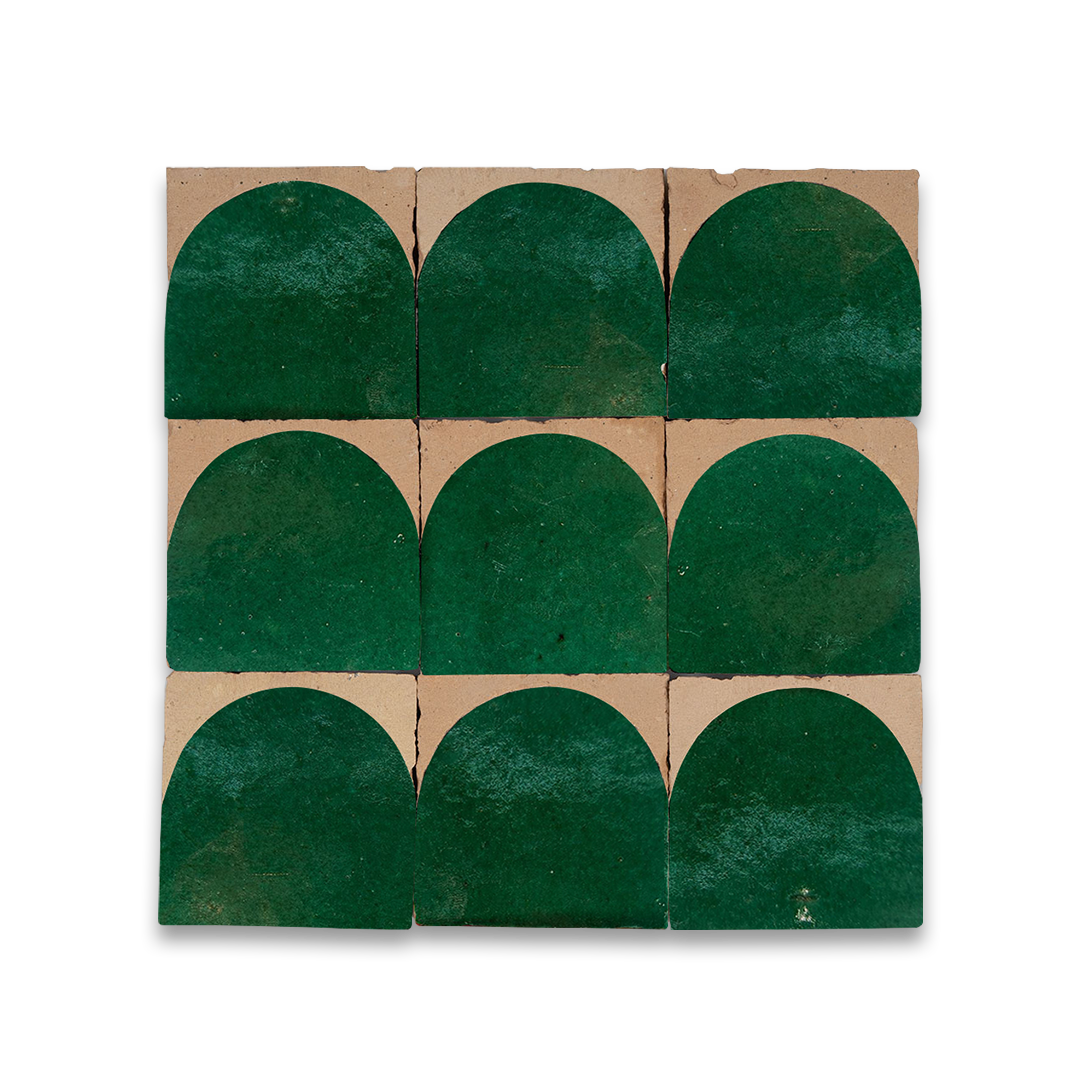 Green ceramic tiles with a scalloped edge on cardboard packaging