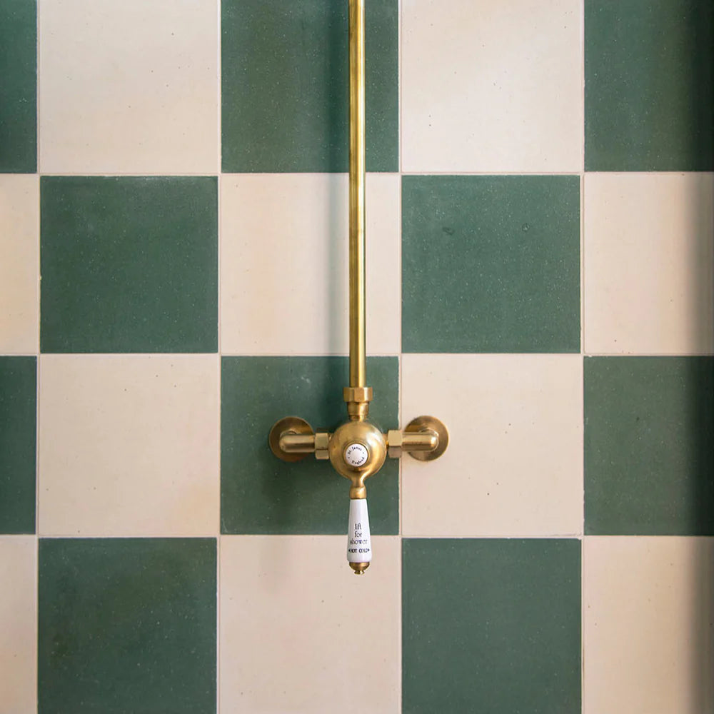 green and beige tiled wall featuring a smooth matte off-white surface with subtle texture, ideal for minimalist interiors, modern flooring, and wall applications in contemporary residential and commercial spaces.