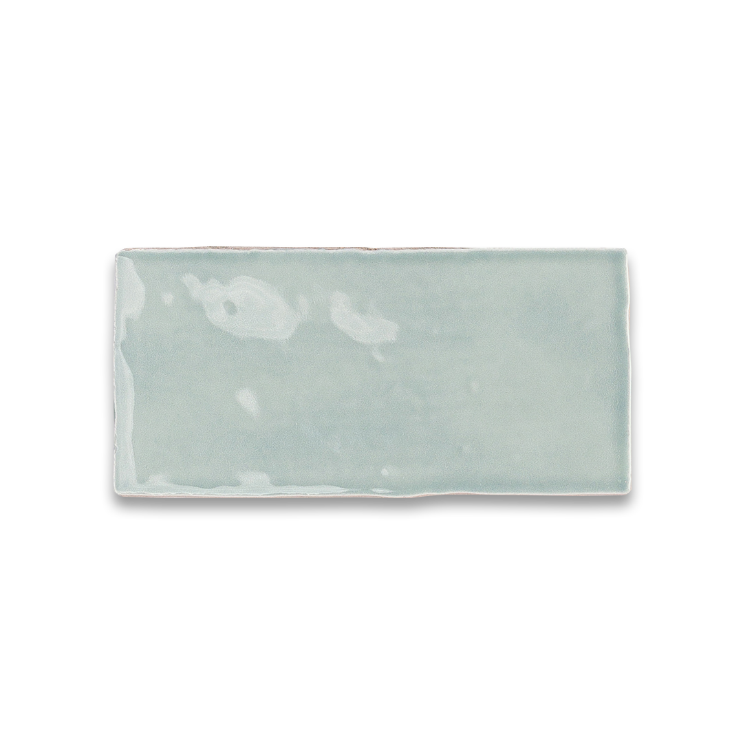 Rectangular ceramic tray with subtle design on a white background