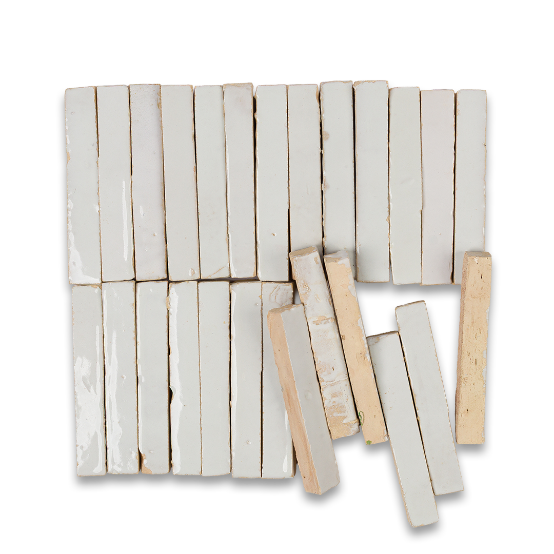White ceramic tiles arranged on a black background, creating a striking contrast in color and texture.