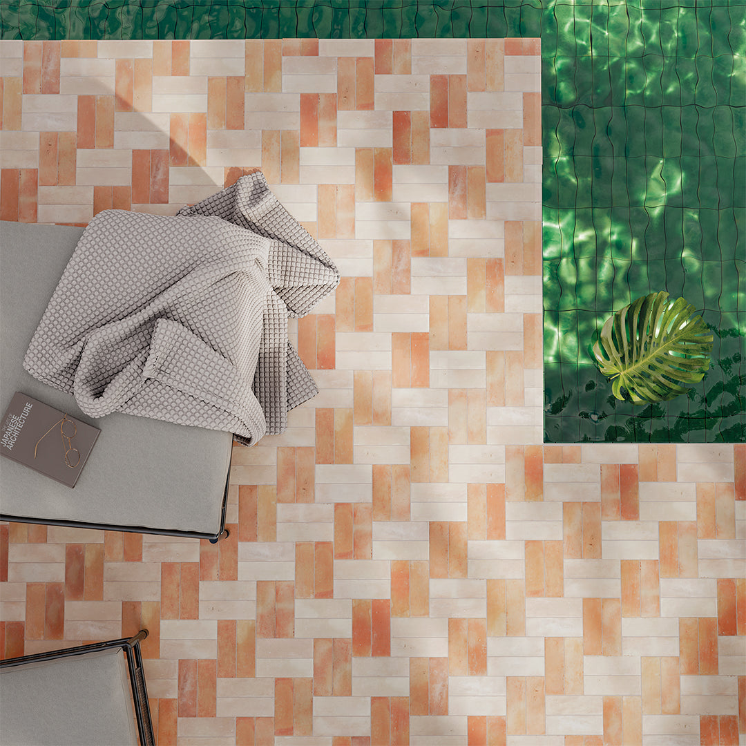 Patterned rug with a chair and blanket on a green leafy background