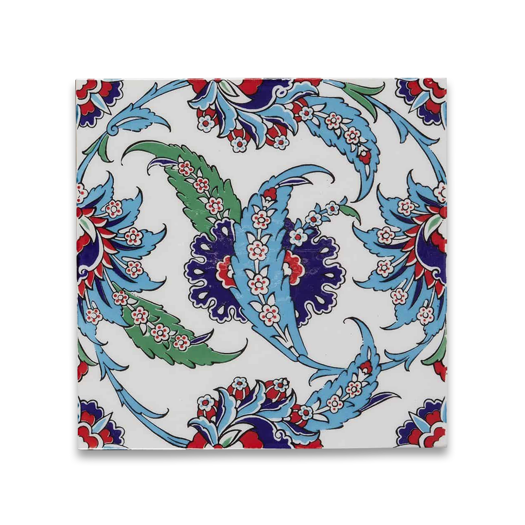 Hand-painted ceramic tile with ornate floral and vine pattern in blue, green, and red.