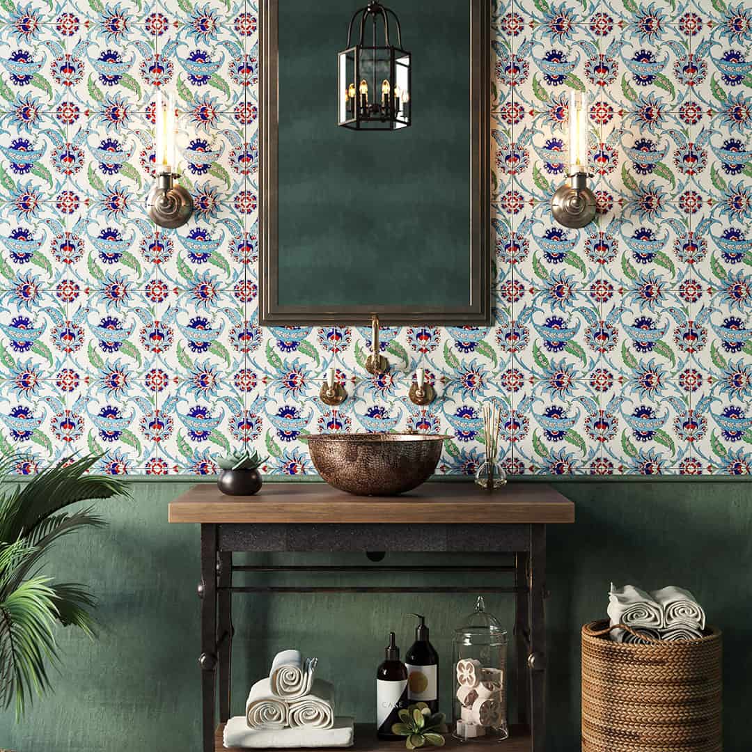 Bathroom vanity with ornate patterned tile wall, brass fixtures, vessel sink, mirror, and warm ambient lighting accents.