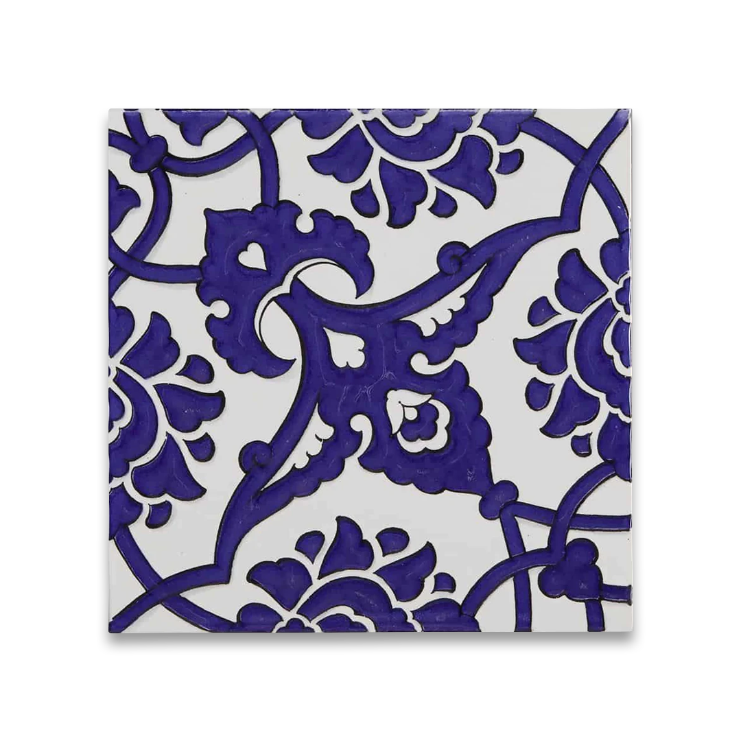 Decorative tile with blue floral pattern. 