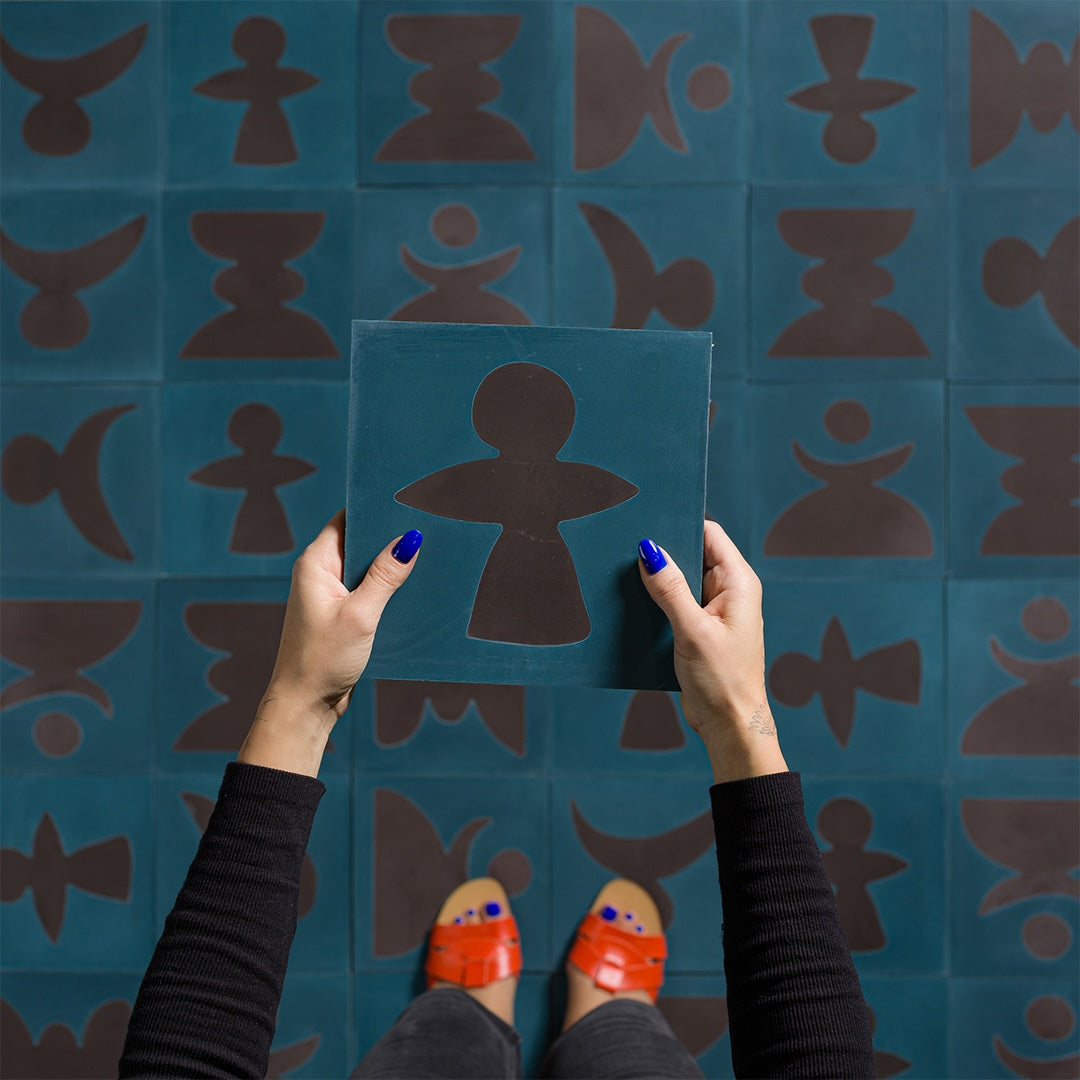 Square blue cement tile featuring bold abstract brown geometric shapes with a matte finish, ideal for artistic flooring, wall cladding, and modern contemporary interior design applications.