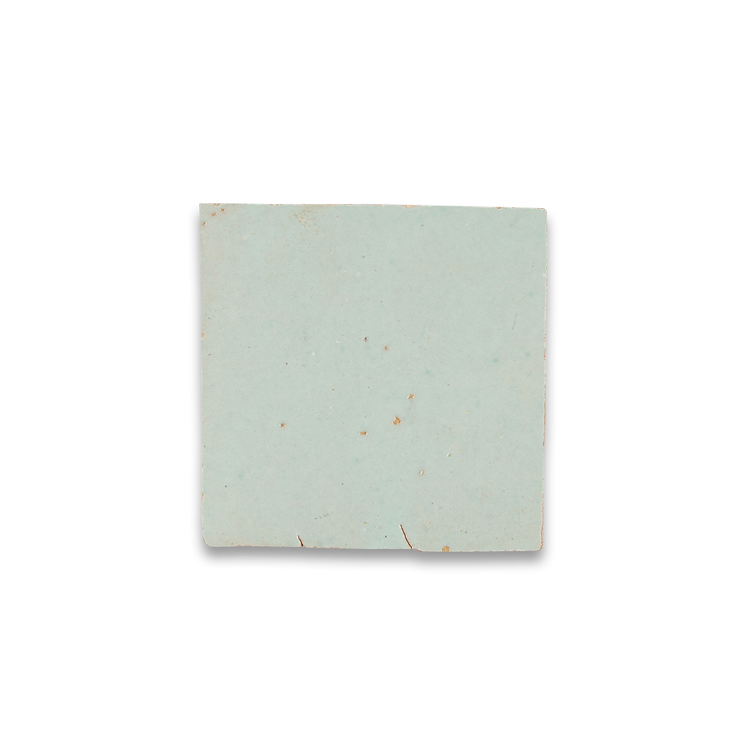 Square tile with a subtle pattern on a white background