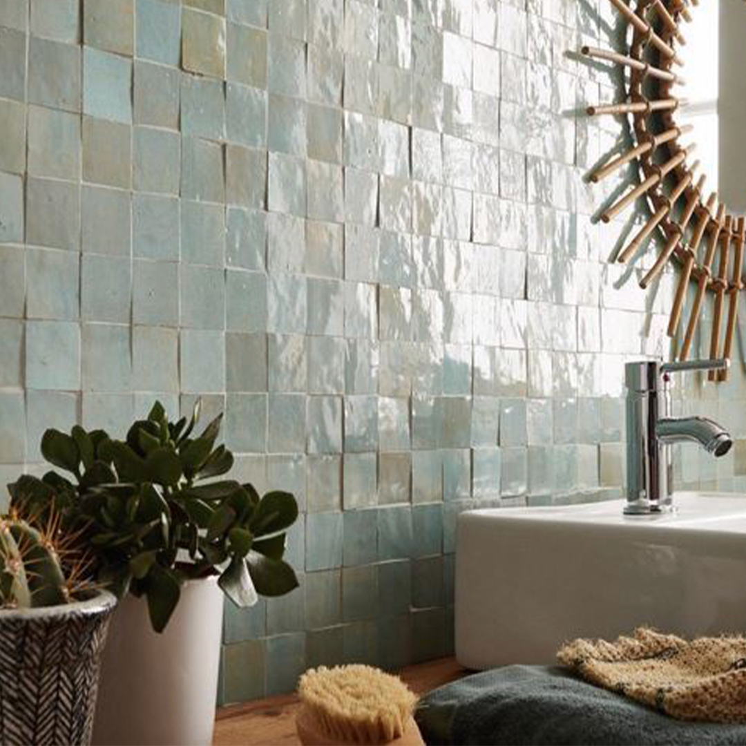 Bathroom with tiled wall, sink, and decorative elements