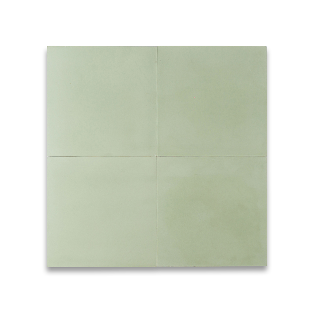 Square cement tile in soft pastel green, minimalist design with smooth surface