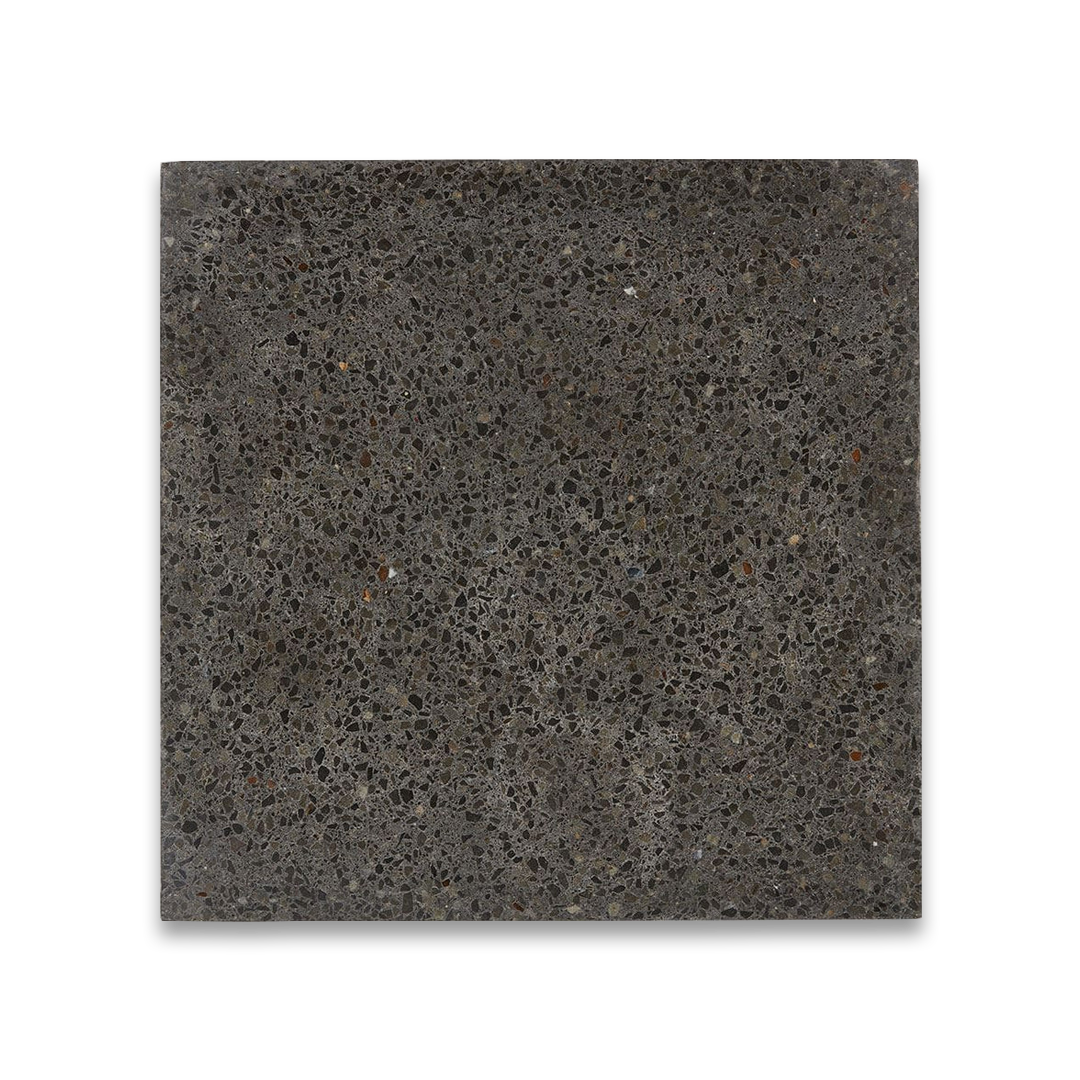 Square tile with a textured black surface. 