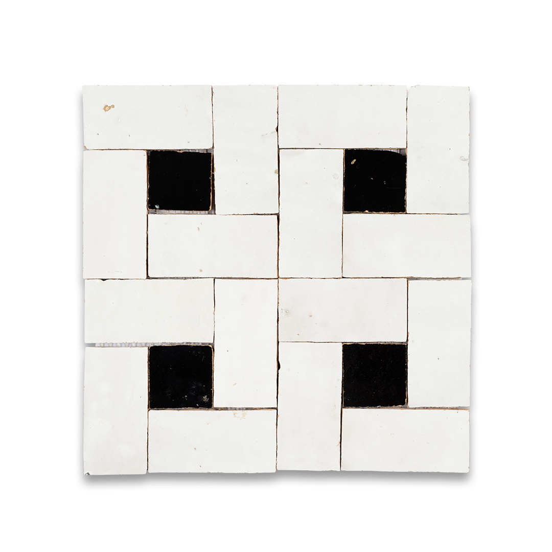 Square tile with a pattern of black and white squares on a white background