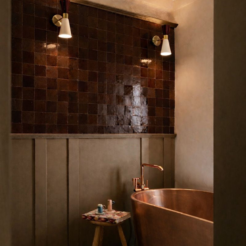 Bathroom with copper bathtub and tiled wall