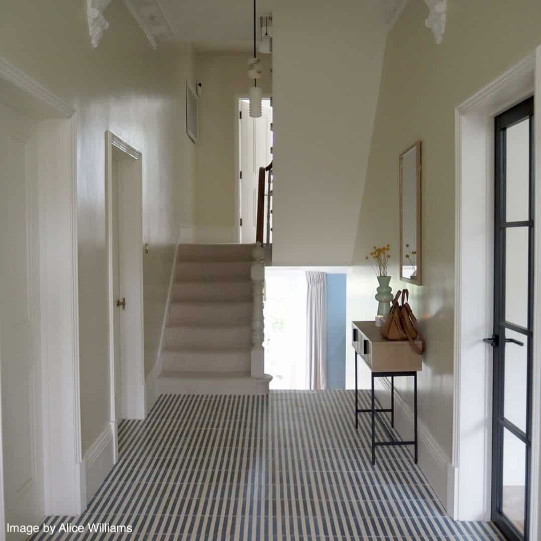 Square blue metro cement tile featuring alternating vertical navy and white stripes with a matte finish, ideal for modern flooring, wall décor, and contemporary interior design applications.