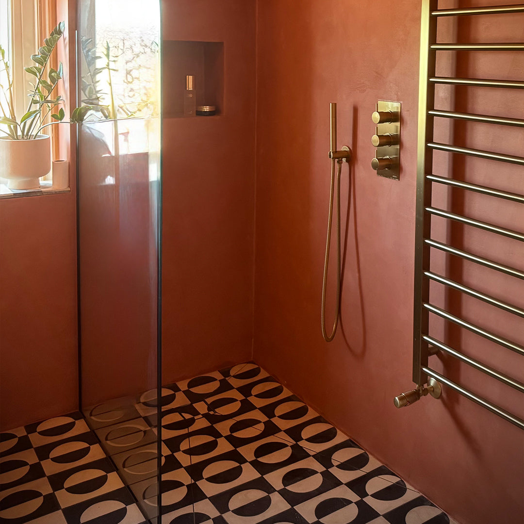 Black and white geometric cement tile featuring a bold circular half-moon pattern, minimalist modern design, matte finish, ideal for contemporary flooring, wall décor, and architectural interior applications.