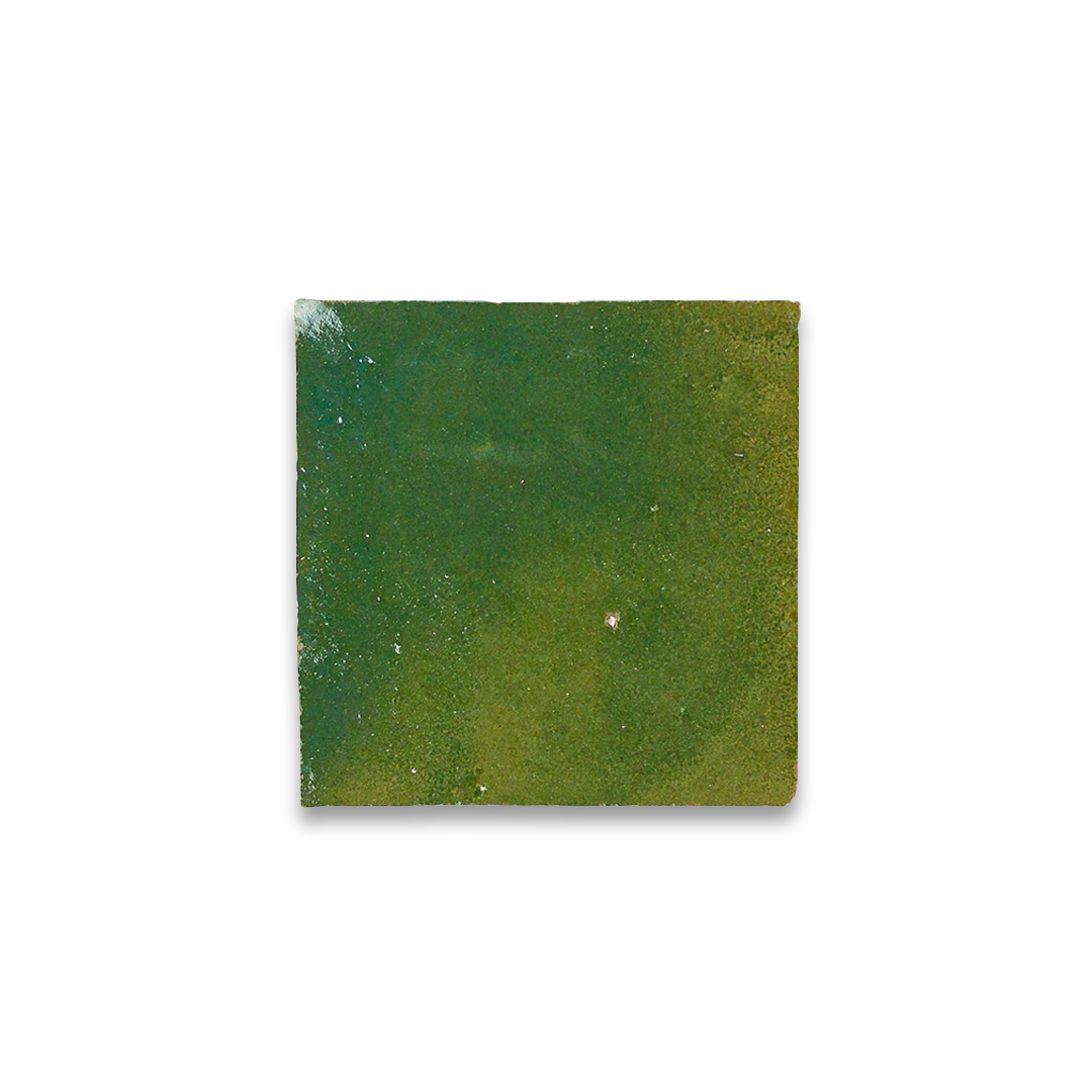 Square green tile with a white border on a white background