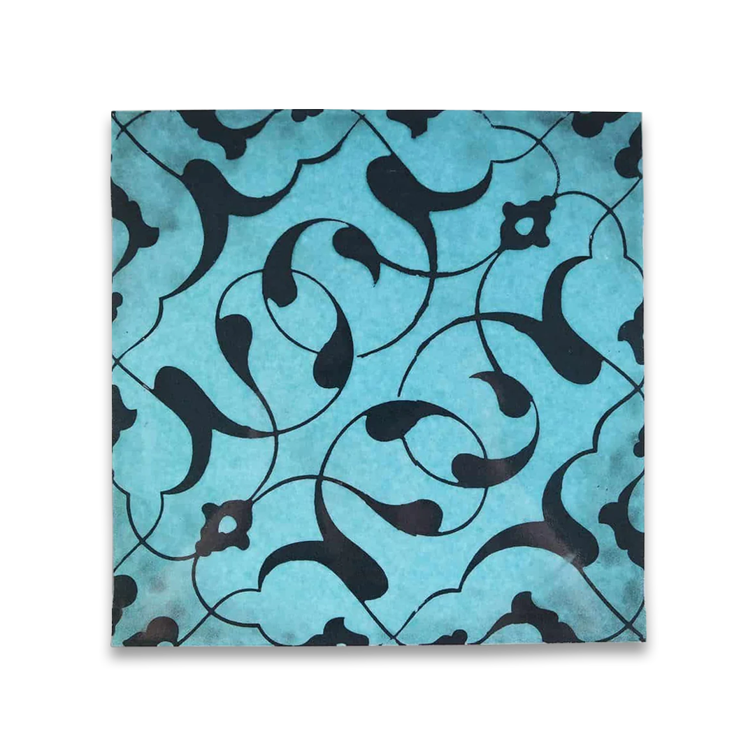 Tile with black floral pattern on a blue background
