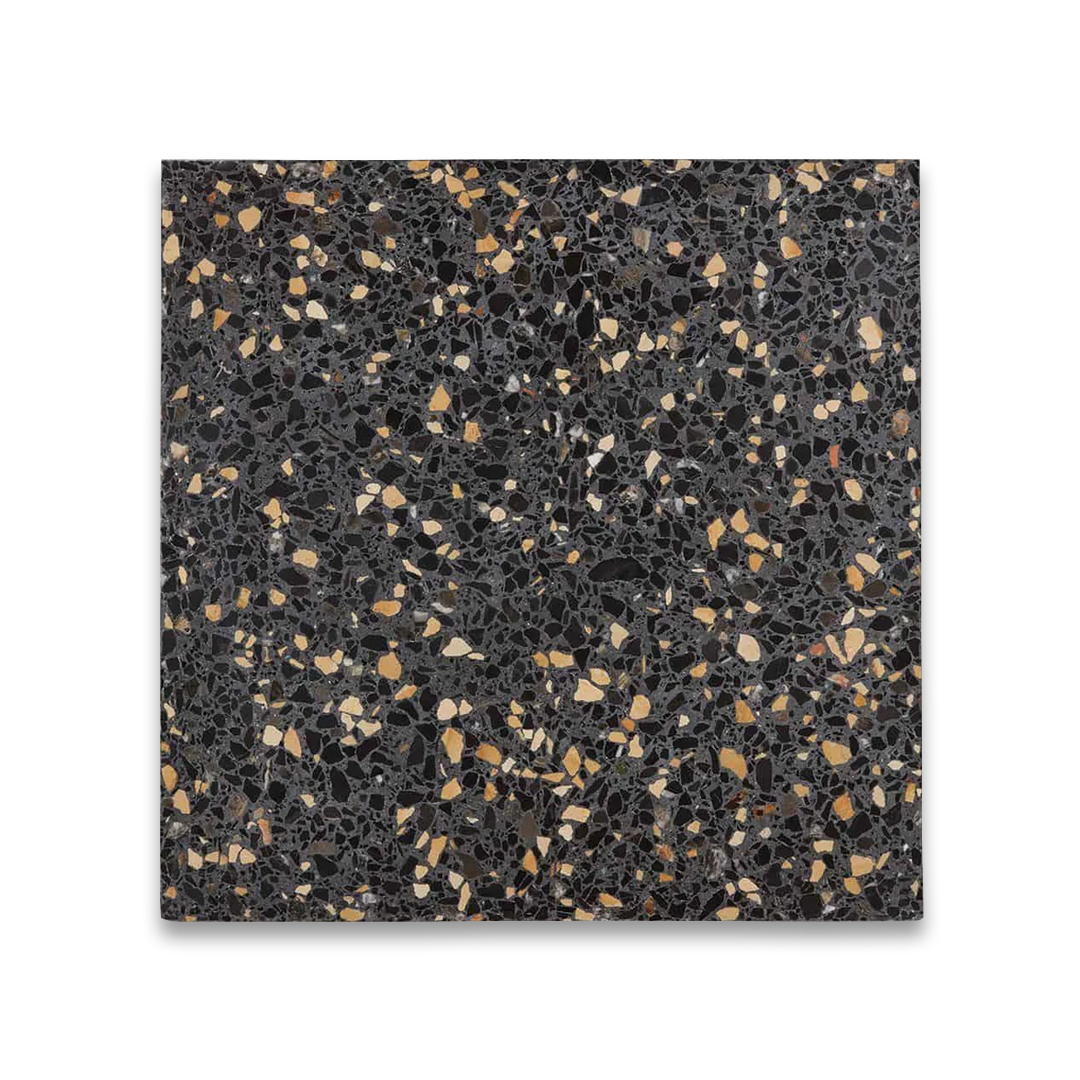 Terrazzo-style tile with black and gold speckles on a white background