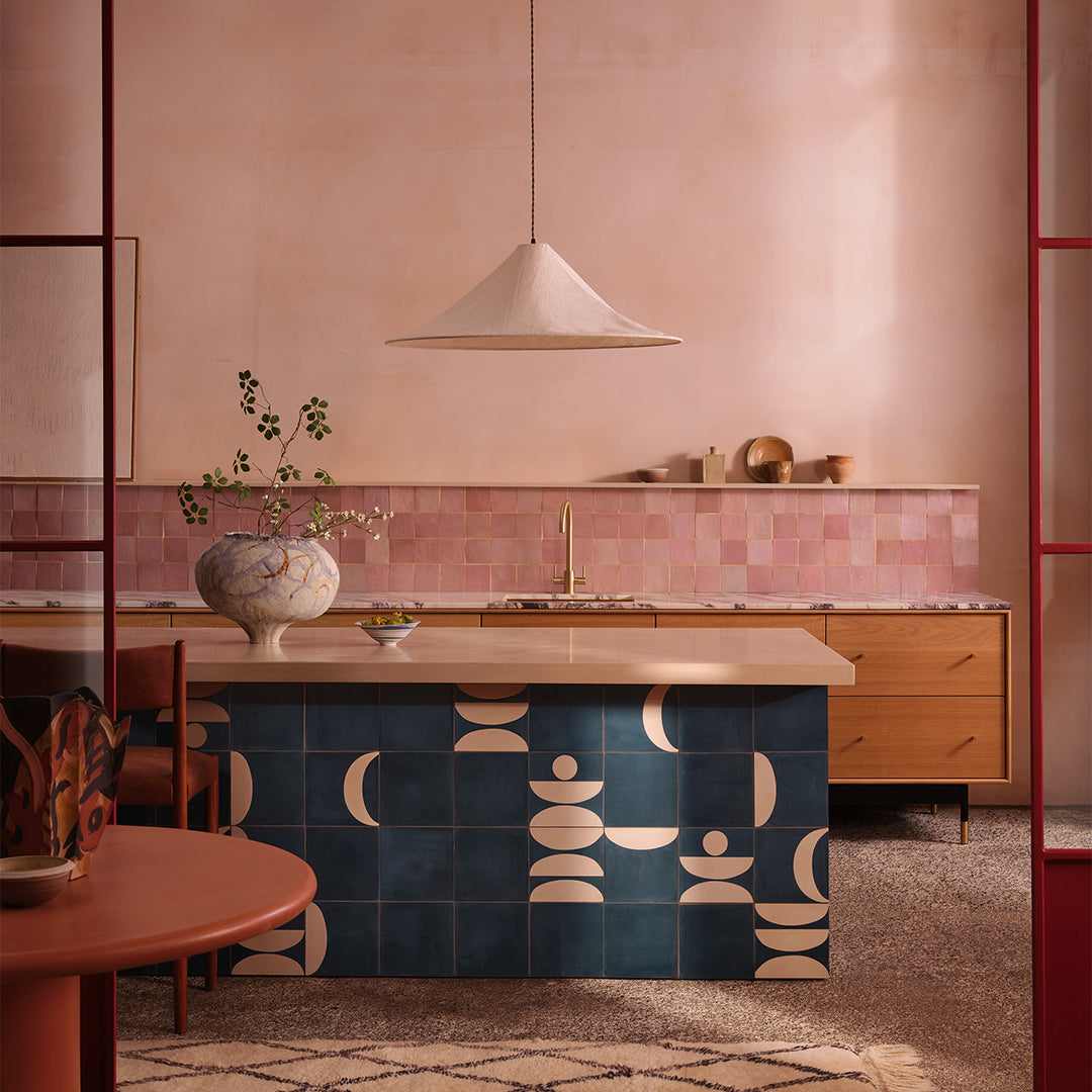 Square blue cement tile featuring abstract geometric white semicircles and circular patterns with a matte finish, ideal for modern flooring, wall cladding, and contemporary interior design applications.