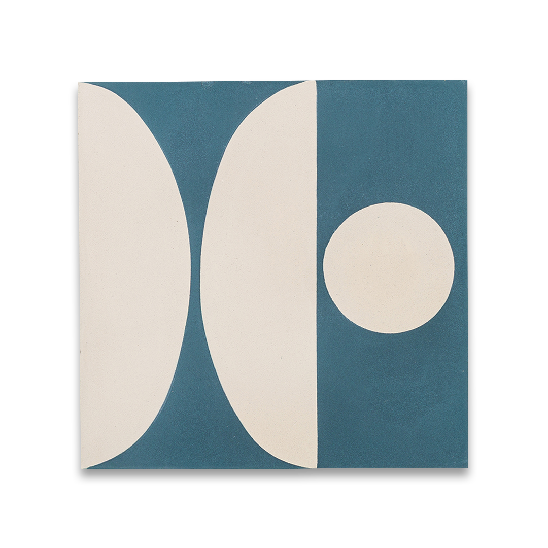 Square blue cement tile featuring abstract geometric white semicircles and circular patterns with a matte finish, ideal for modern flooring, wall cladding, and contemporary interior design applications.