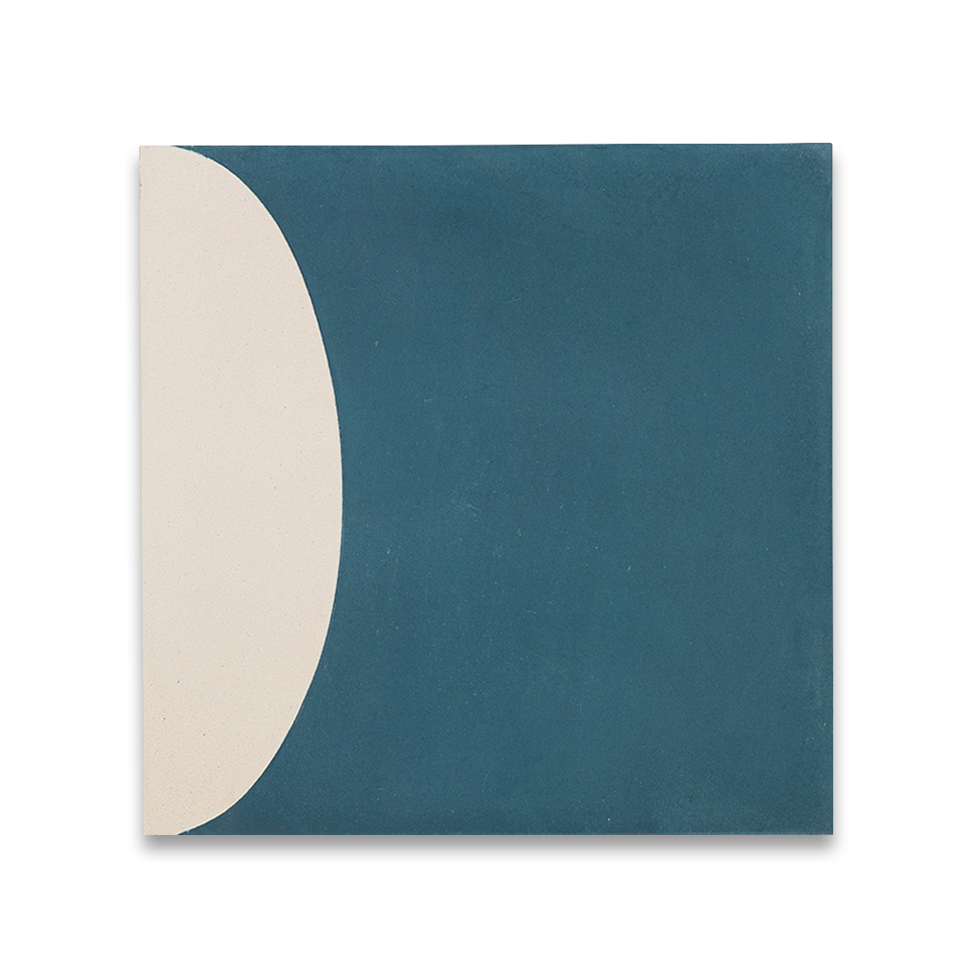 Square blue cement tile featuring abstract geometric white semicircles and circular patterns with a matte finish, ideal for modern flooring, wall cladding, and contemporary interior design applications.