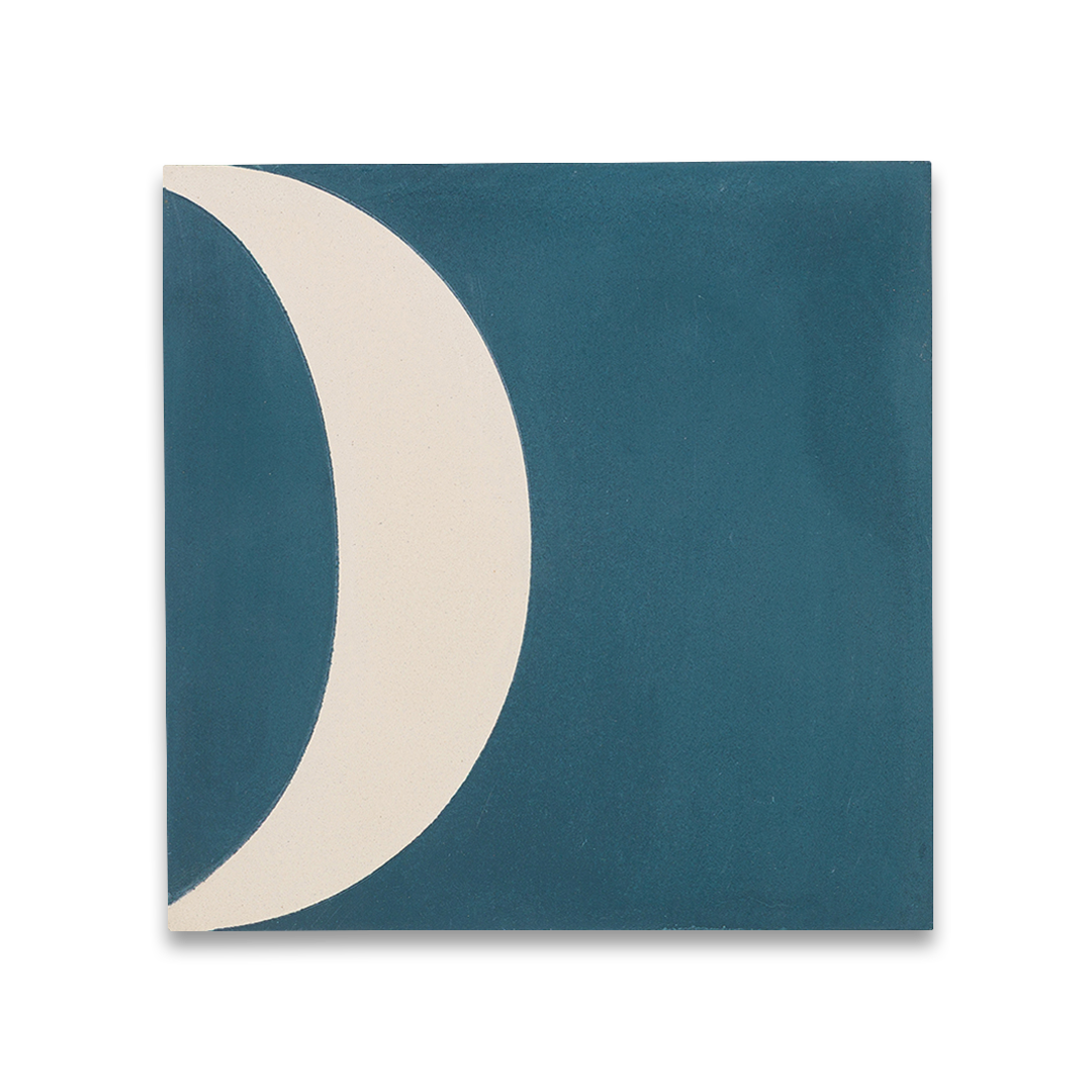 Square blue cement tile featuring abstract geometric white semicircles and circular patterns with a matte finish, ideal for modern flooring, wall cladding, and contemporary interior design applications.