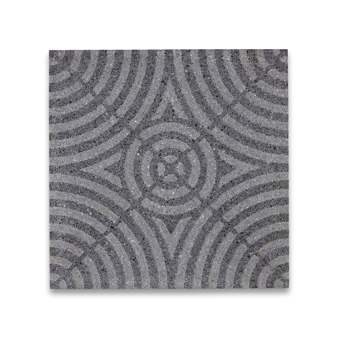 A square cement tile featuring a textured gray surface with concentric circular patterns intersecting at the center, creating a geometric, symmetrical, and modern decorative design.