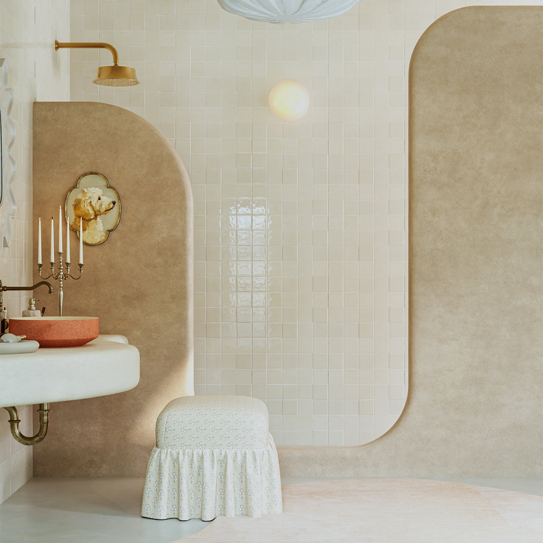 Modern bathroom with beige walls, a sink, and decorative elements.