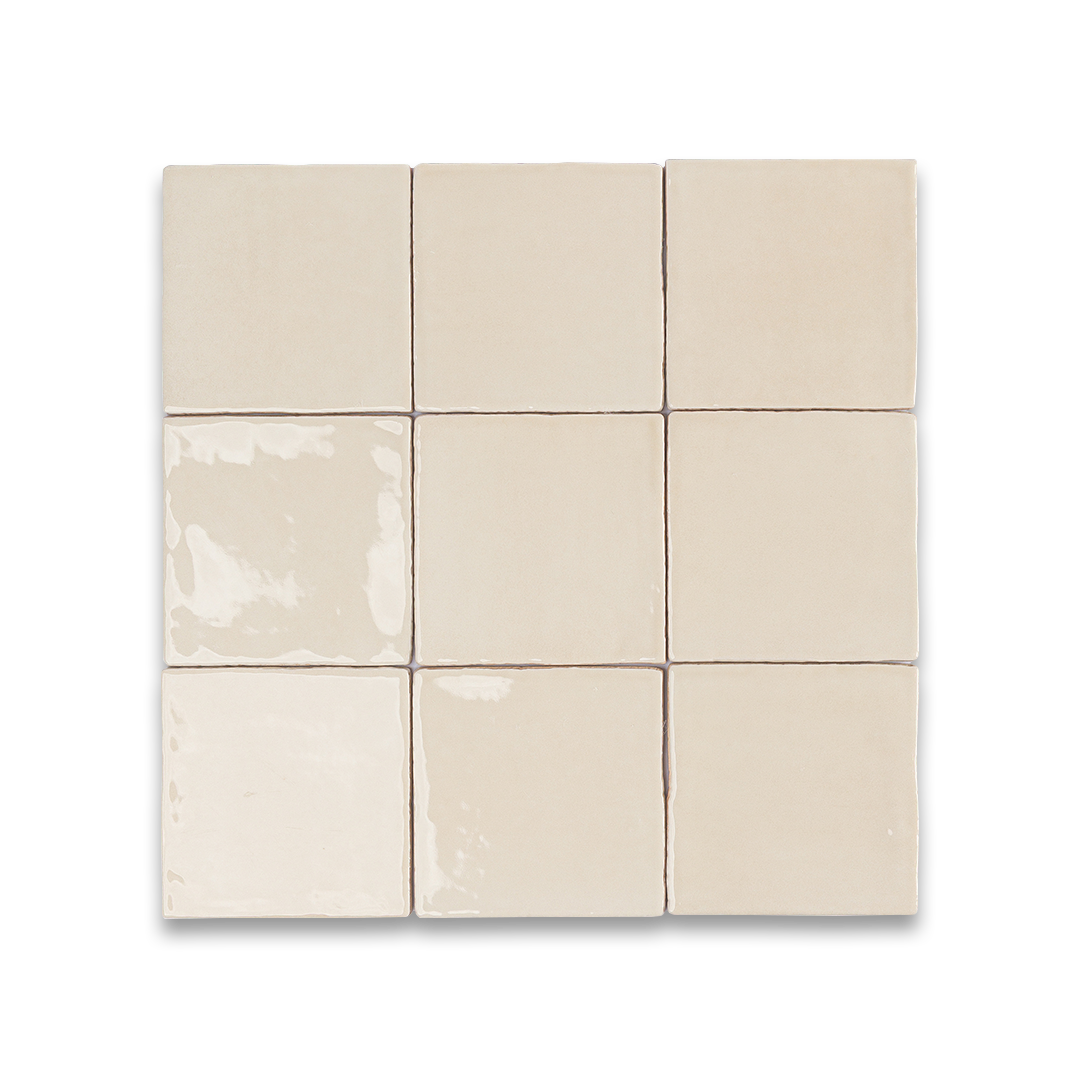 Nine beige ceramic tiles arranged in a 3x3 grid on a white background