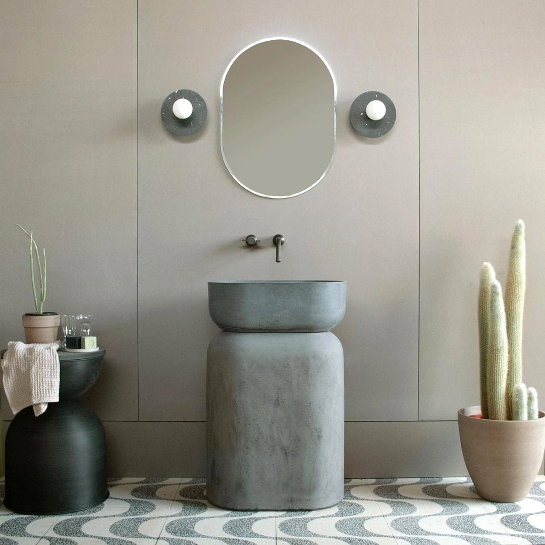 A square cement tile featuring a white background with curved, wave-like gray terrazzo patterns containing white speckles, creating a modern, rhythmic, and textured geometric design.