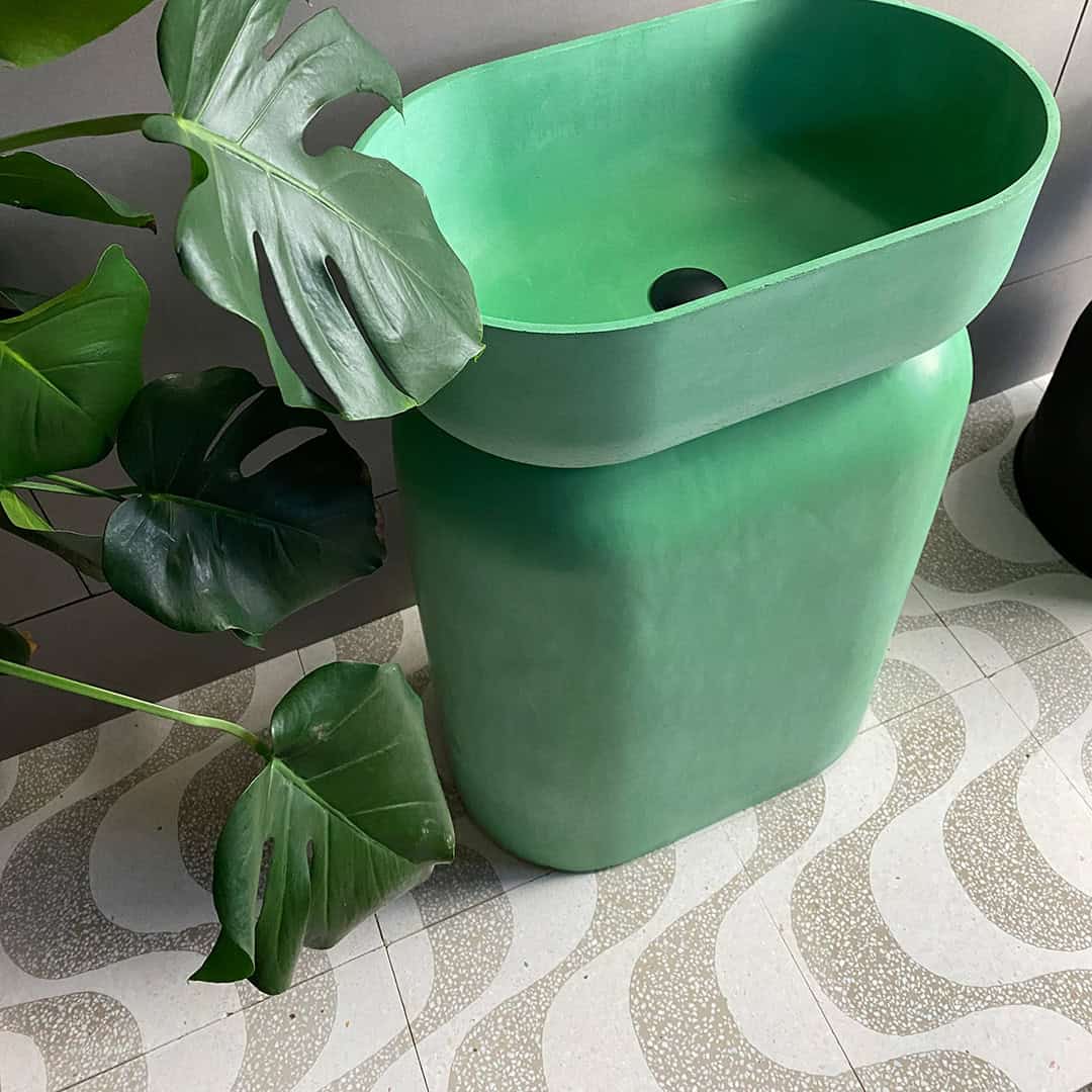 A square cement tile featuring a white background with curved beige wave-like patterns filled with small white speckles, creating a soft, organic, and modern decorative design.