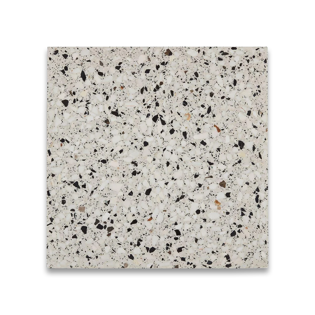 Terrazzo tile with a speckled pattern on a white background