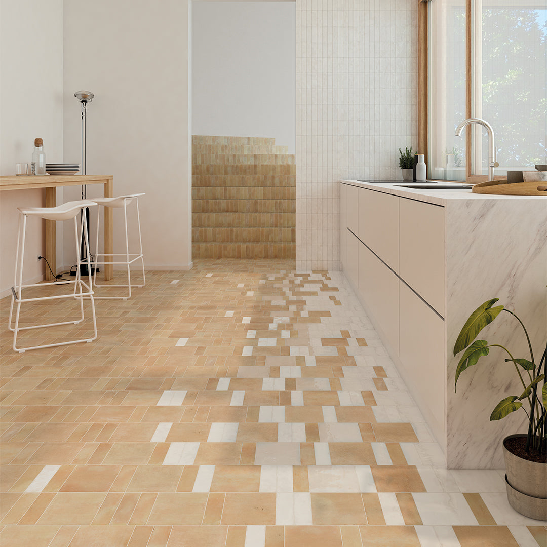 Modern kitchen with tiled floor and light wood cabinets