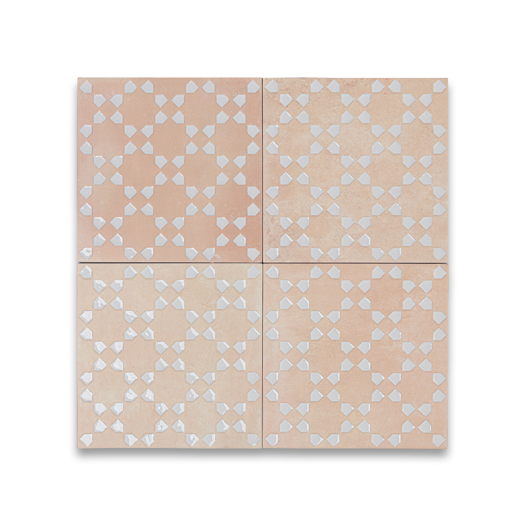 Four beige tiles with a subtle pattern on a white background