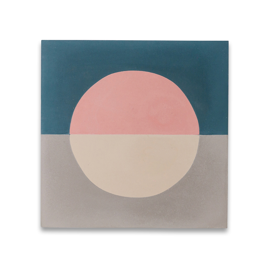 Square ceramic tile with minimalist abstract design, teal and gray halves featuring central circle in pink and cream, resembling stylized sunrise or sunset.