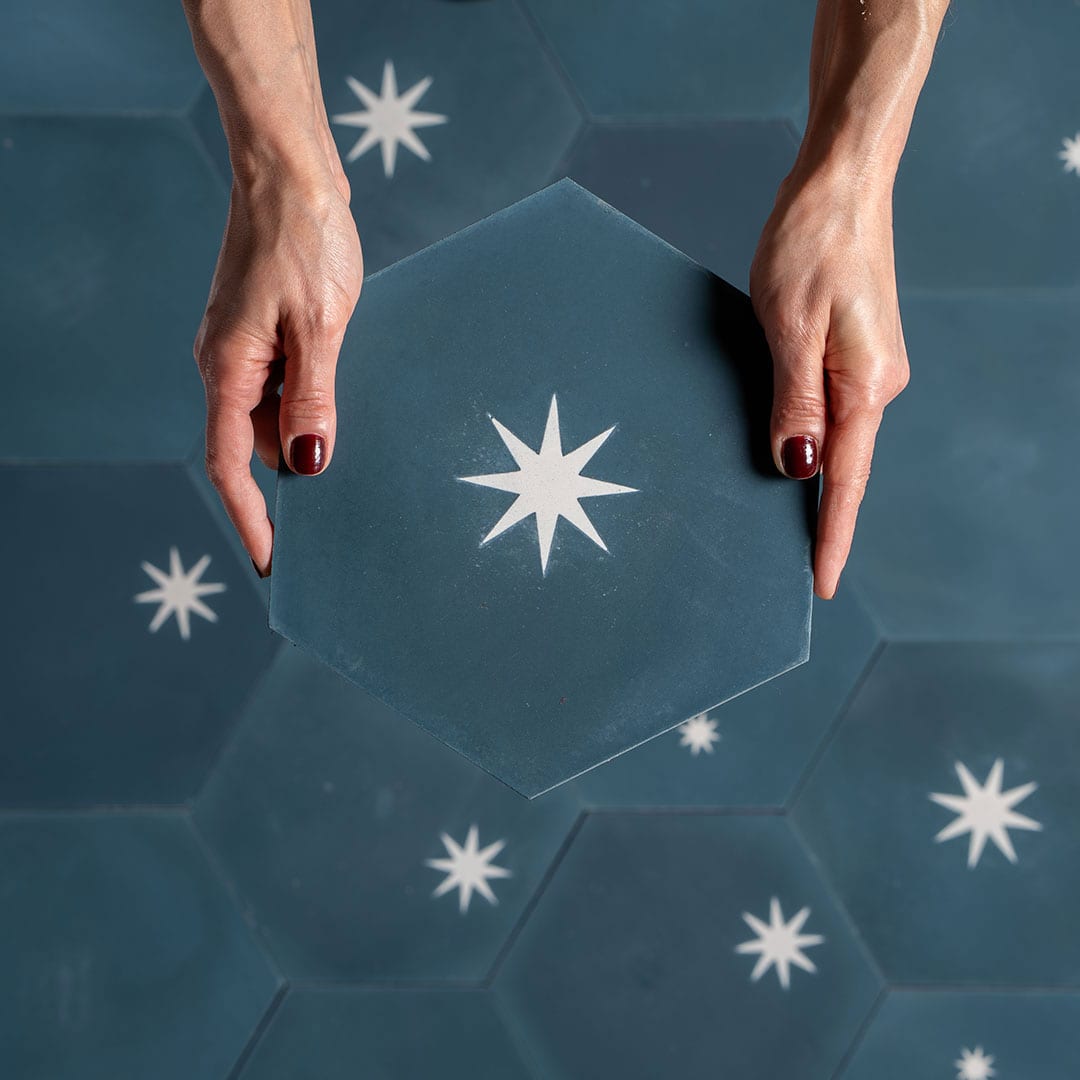 Decorative cement tile design featuring three teal hexagonal tiles with white starburst motifs, arranged in triangular formation, ideal for modern interiors and architectural accents