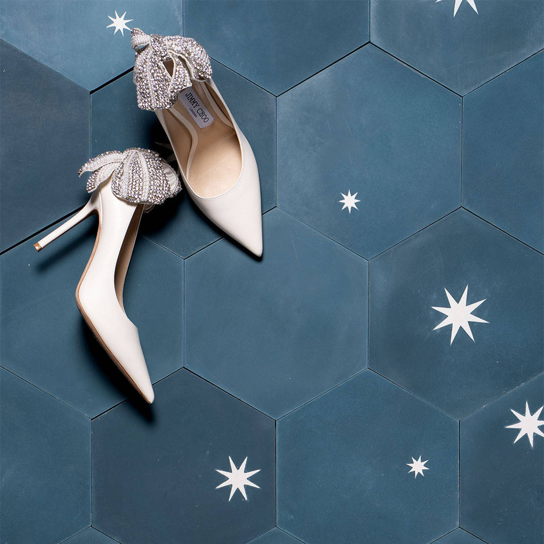 Decorative cement tile design featuring three teal hexagonal tiles with white starburst motifs, arranged in triangular formation, ideal for modern interiors and architectural accents